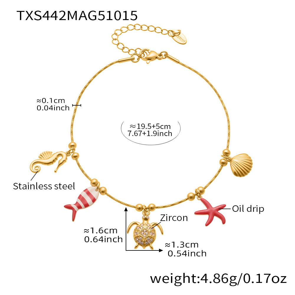Gold plated ocean charm jewelry set with Ferris wheel necklace, octopus bracelet, turtle zircon pendant, and matching earrings