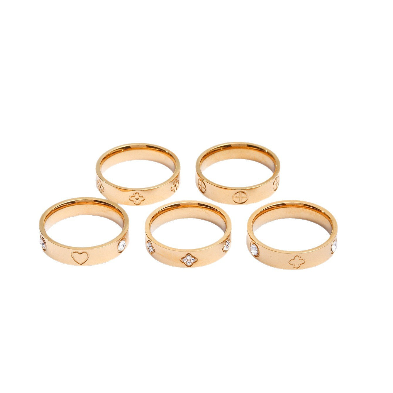 Gold plated clover heart ring set with stackable geometric stainless steel design