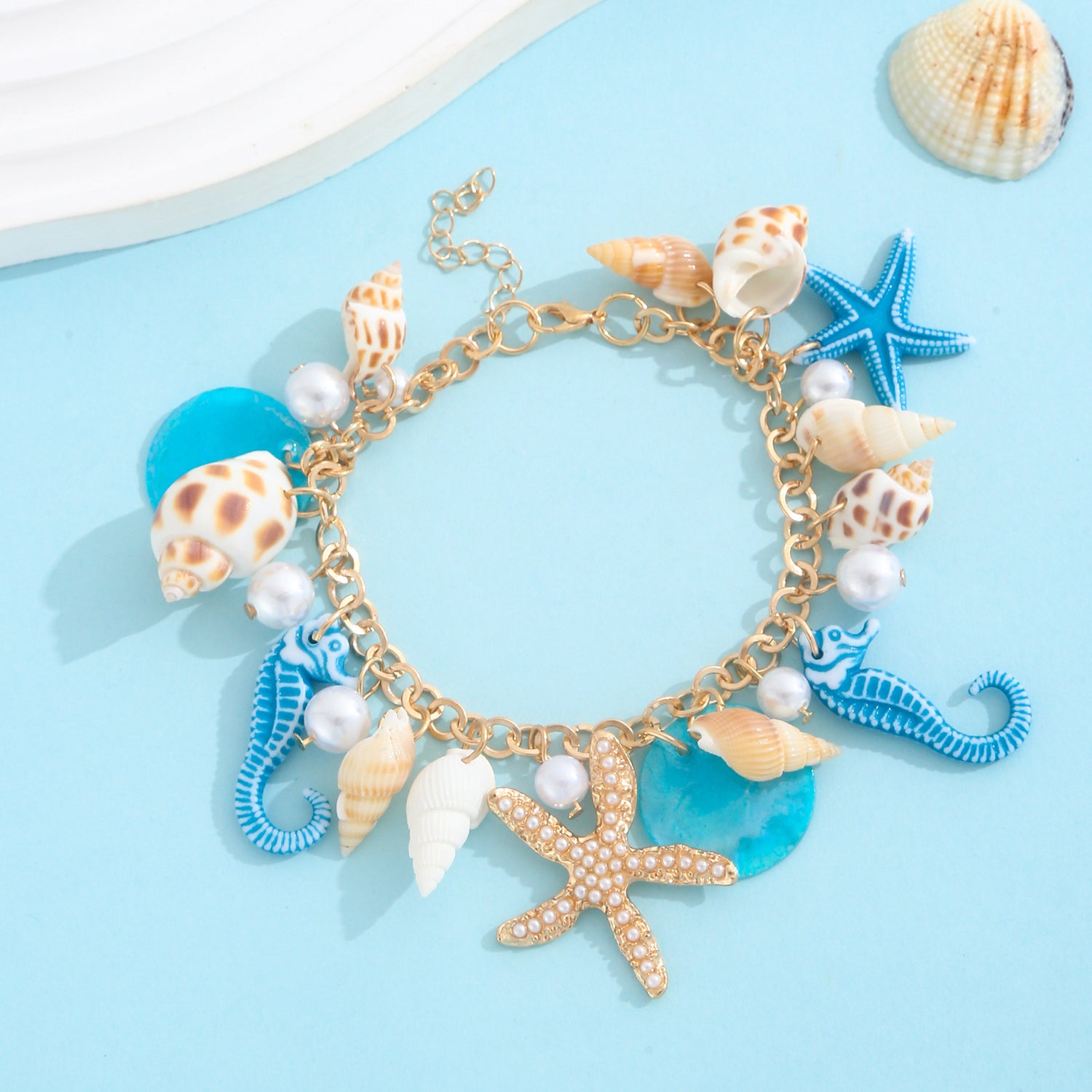 Gold plated beach anklet with starfish and shell charms in bohemian Hawaiian style