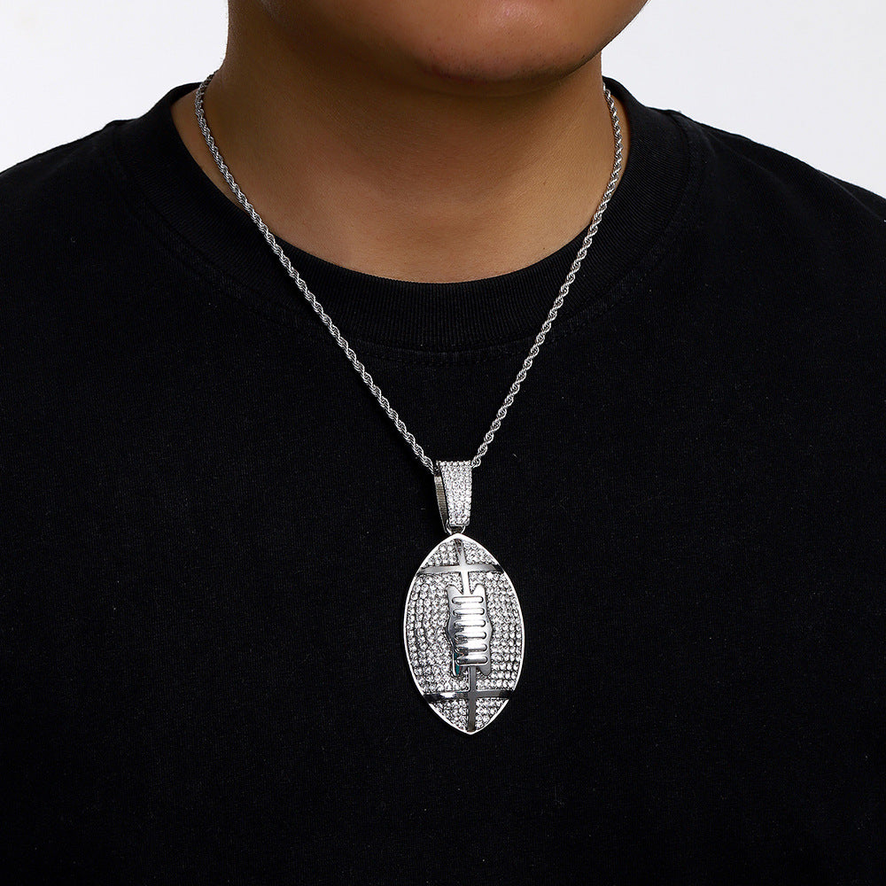 Gold plated football pendant necklace with iced out rhinestone design and hip hop chain style