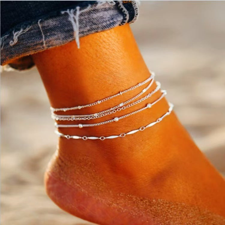 Gold chain anklet set with 5 layered chain styles for beach and minimalist summer fashion