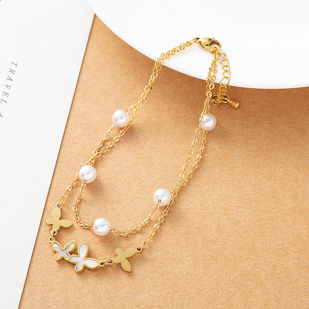 Gold plated butterfly anklet with pearl beads and double-layer chain design for women