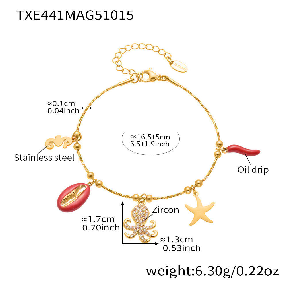Gold plated ocean charm jewelry set with Ferris wheel necklace, octopus bracelet, turtle zircon pendant, and matching earrings