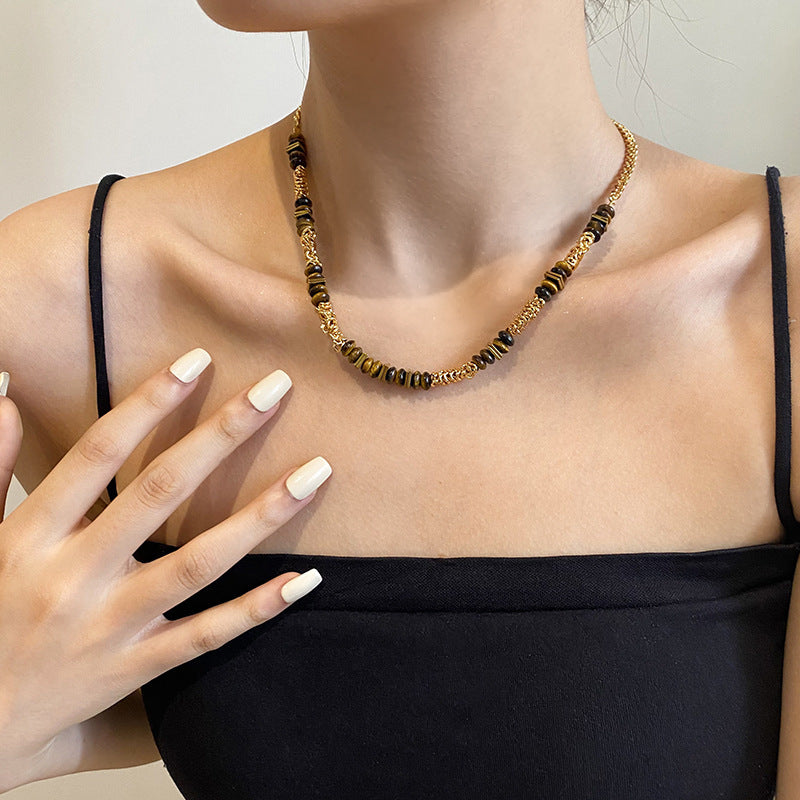 Gold plated tiger eye stone necklace with long sweater chain and floral-inspired design