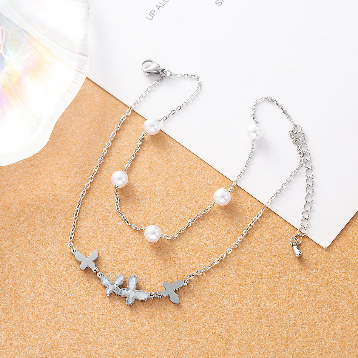 Gold plated butterfly anklet with pearl beads and double-layer chain design for women
