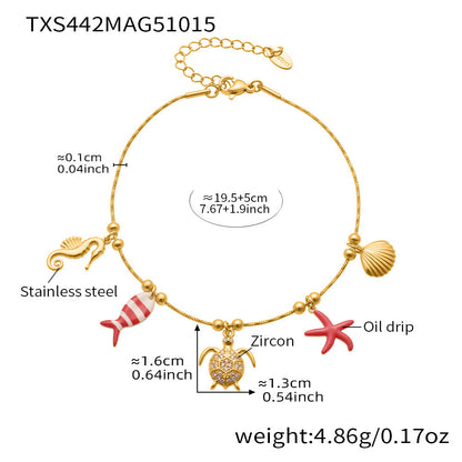 Gold plated ocean charm jewelry set with Ferris wheel necklace, octopus bracelet, turtle zircon pendant, and matching earrings