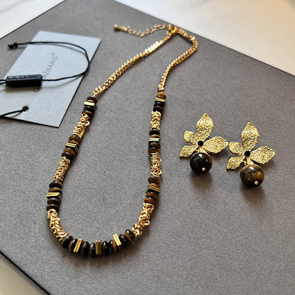 Gold plated tiger eye stone necklace with long sweater chain and floral-inspired design