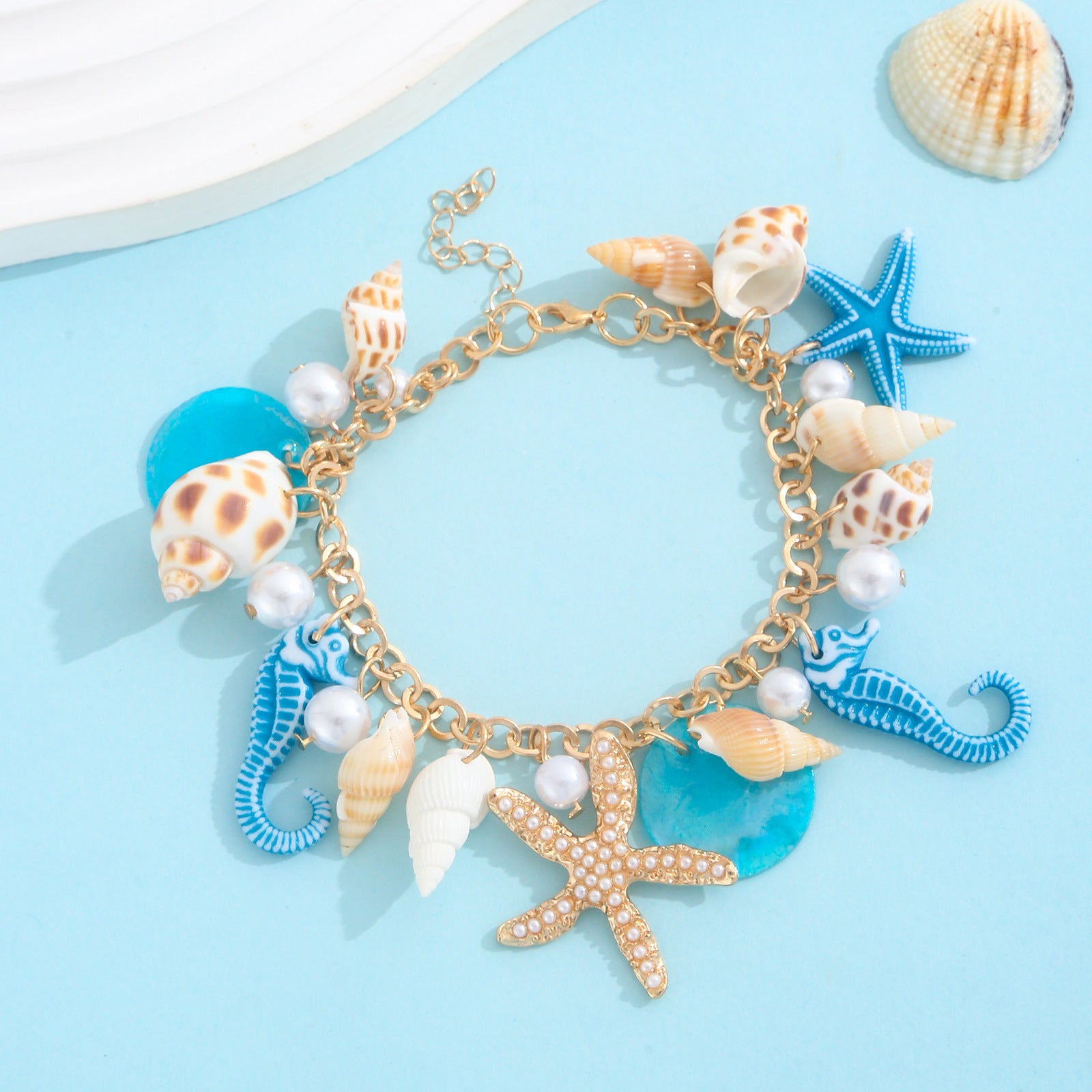 Gold plated beach anklet with starfish and shell charms in bohemian Hawaiian style