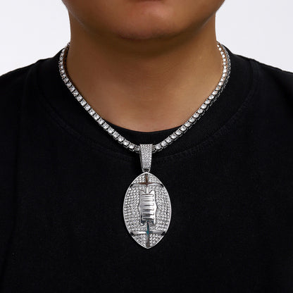 Gold plated football pendant necklace with iced out rhinestone design and hip hop chain style