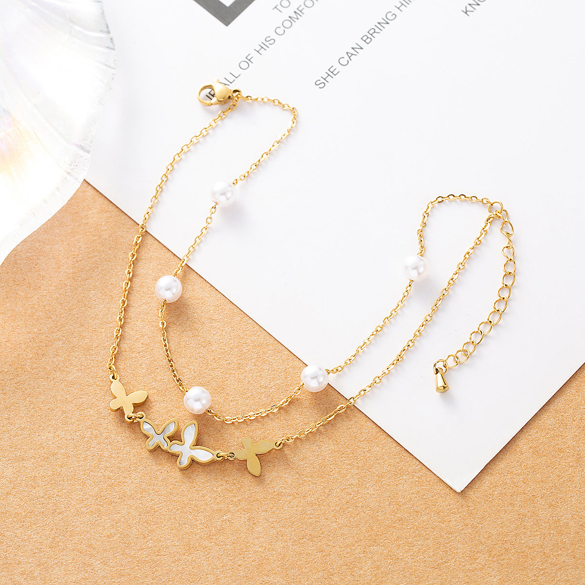 Gold plated butterfly anklet with pearl beads and double-layer chain design for women