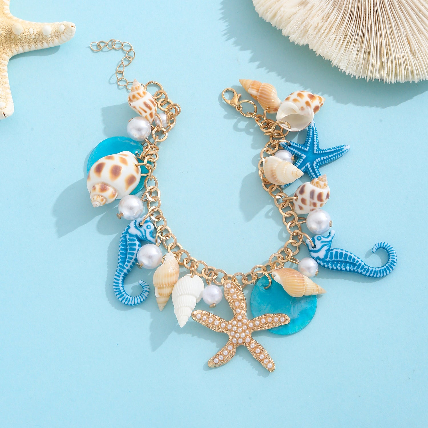 Gold plated beach anklet with starfish and shell charms in bohemian Hawaiian style