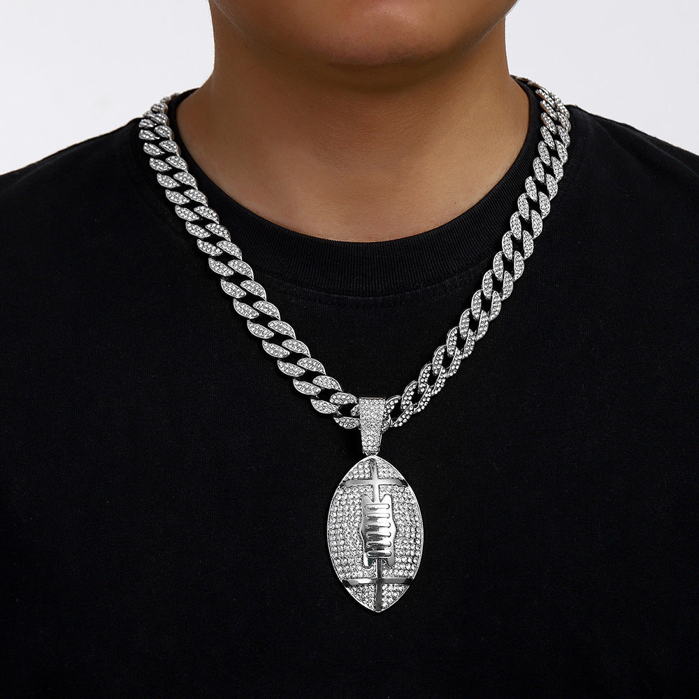 Gold plated football pendant necklace with iced out rhinestone design and hip hop chain style