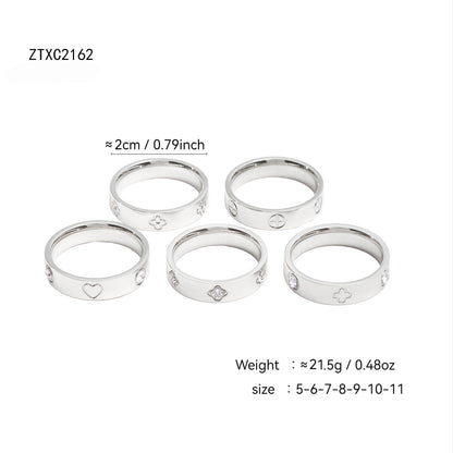 Gold plated clover heart ring set with stackable geometric stainless steel design