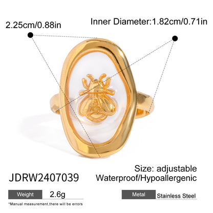 Gold plated gemstone ring with minimalist adjustable band and geometric star detail