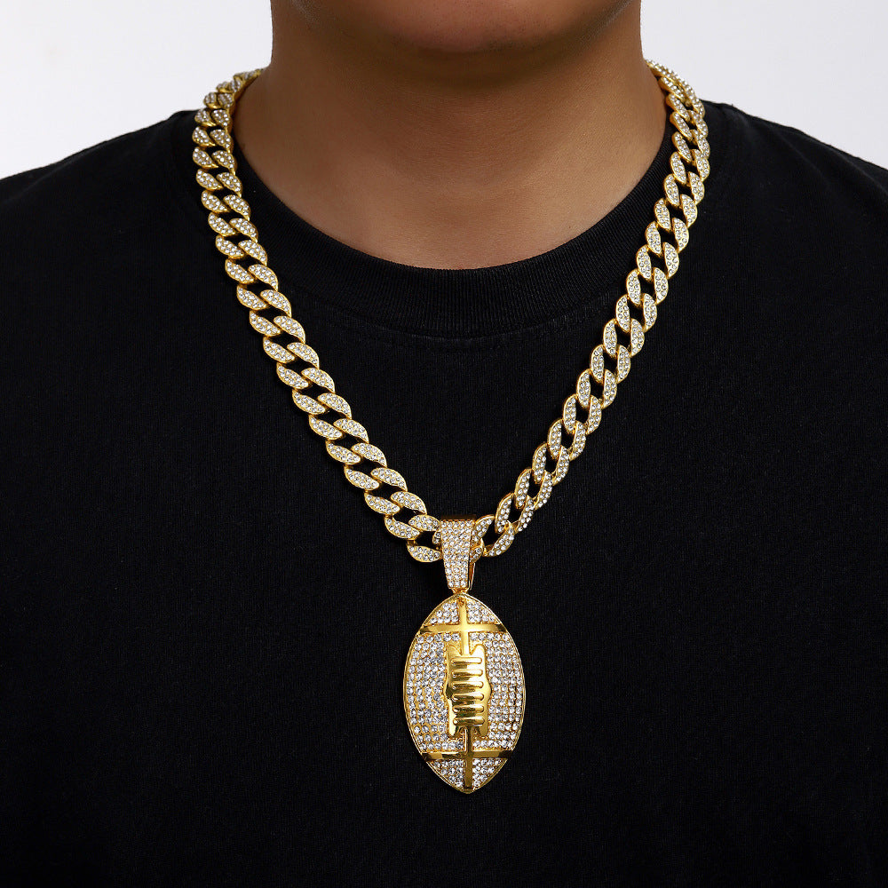 Gold plated football pendant necklace with iced out rhinestone design and hip hop chain style