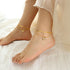 Gold plated butterfly anklet with zircon charm, shell accent, and double-layer snake chain
