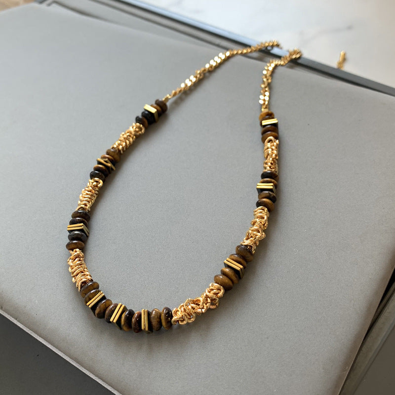 Gold plated tiger eye stone necklace with long sweater chain and floral-inspired design