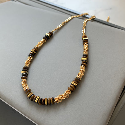 Gold plated tiger eye stone necklace with long sweater chain and floral-inspired design