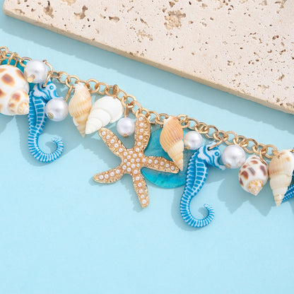 Gold plated beach anklet with starfish and shell charms in bohemian Hawaiian style