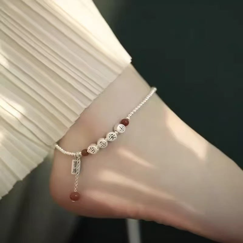 Silver peace happiness anklet with diamond-shaped details and elegant minimalist design