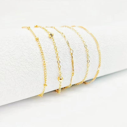 Gold chain anklet set with 5 layered chain styles for beach and minimalist summer fashion