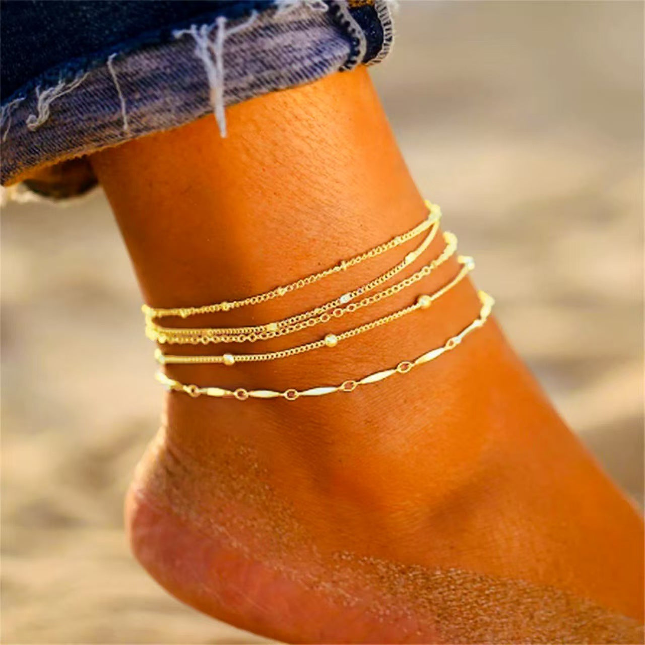 Gold chain anklet set with 5 layered chain styles for beach and minimalist summer fashion