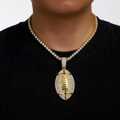 Gold plated football pendant necklace with iced out rhinestone design and hip hop chain style