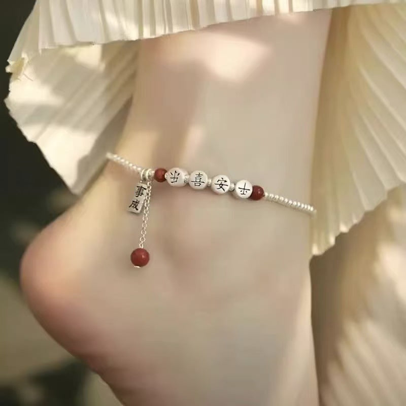 Silver peace happiness anklet with diamond-shaped details and elegant minimalist design
