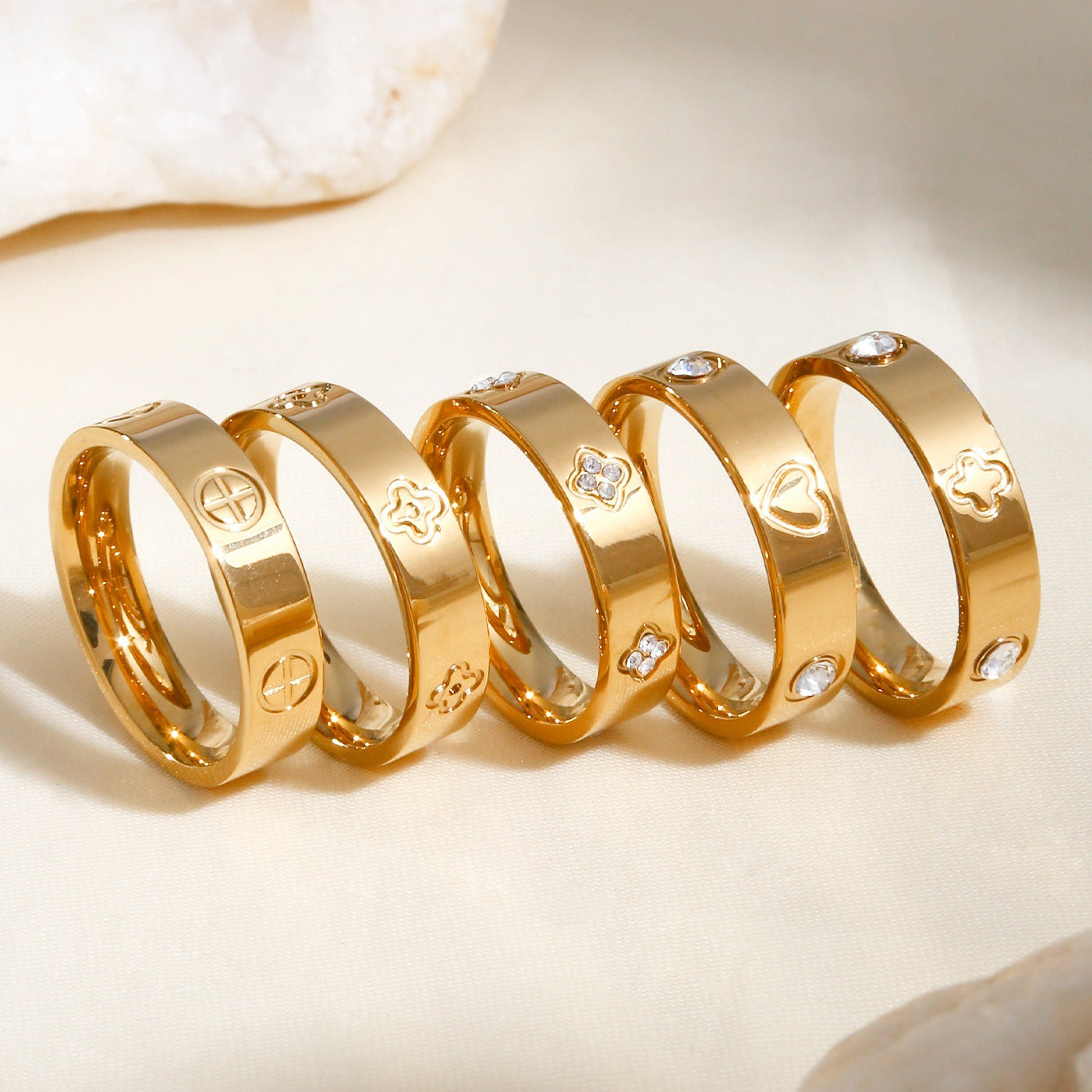 Gold plated clover heart ring set with stackable geometric stainless steel design