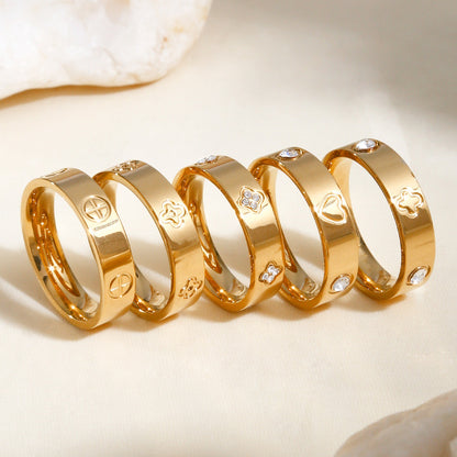 Gold plated clover heart ring set with stackable geometric stainless steel design