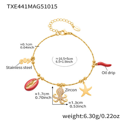 Gold plated ocean charm jewelry set with Ferris wheel necklace, octopus bracelet, turtle zircon pendant, and matching earrings