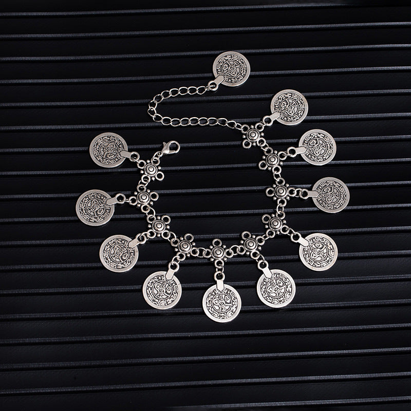 Bohemian coin tassel anklet with retro coin charms and flowing tassels for beach and festival styling