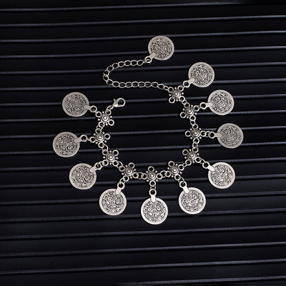 Bohemian coin tassel anklet with retro coin charms and flowing tassels for beach and festival styling