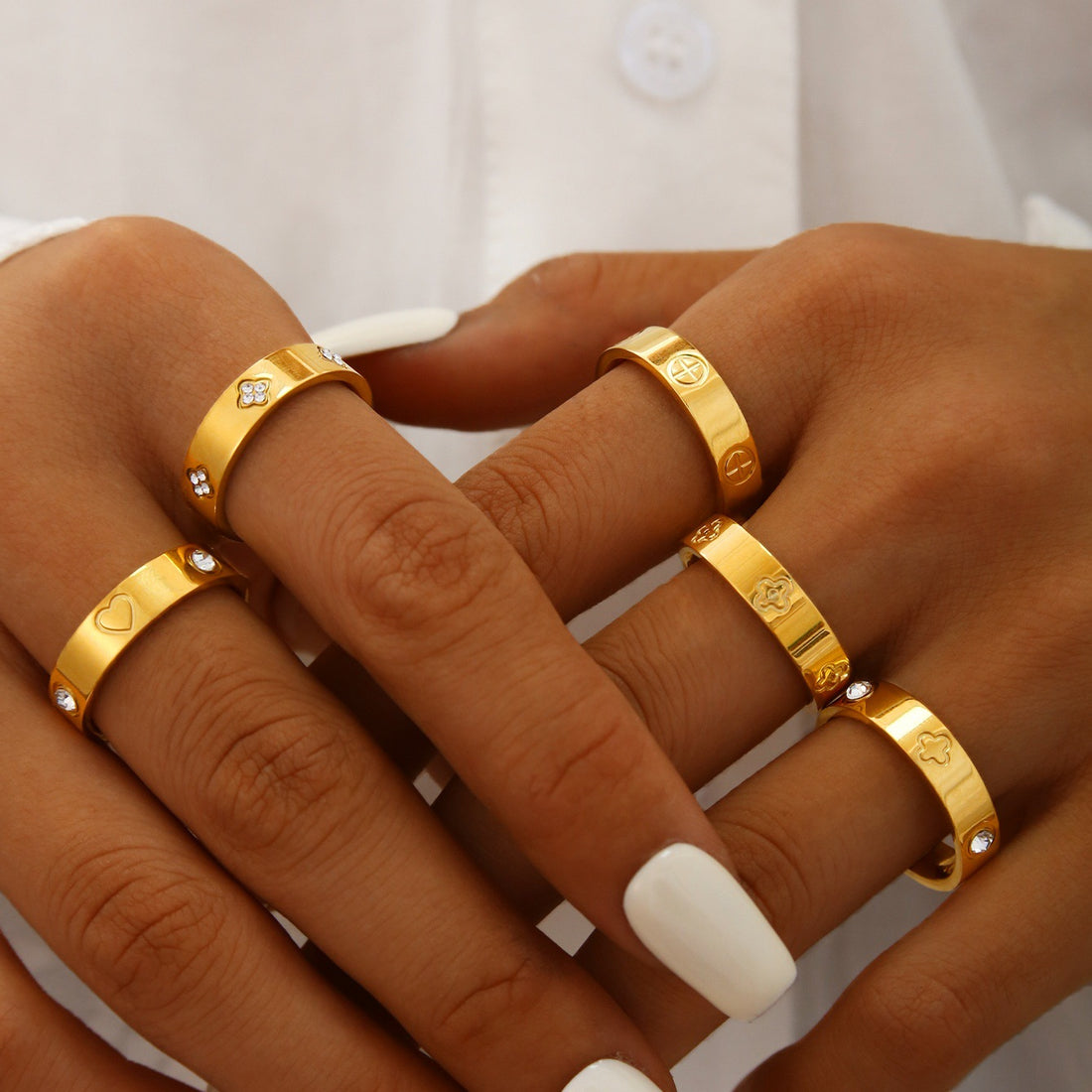 Gold plated clover heart ring set with stackable geometric stainless steel design