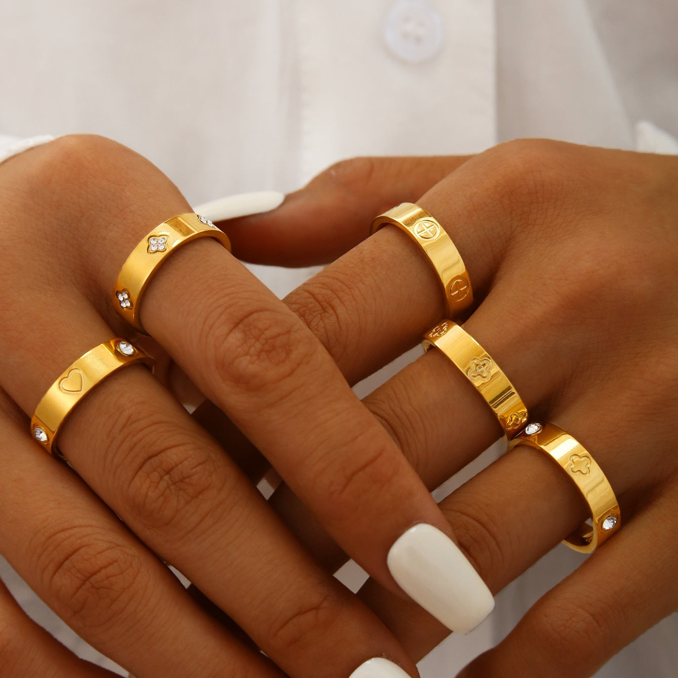 Gold plated clover heart ring set with stackable geometric stainless steel design