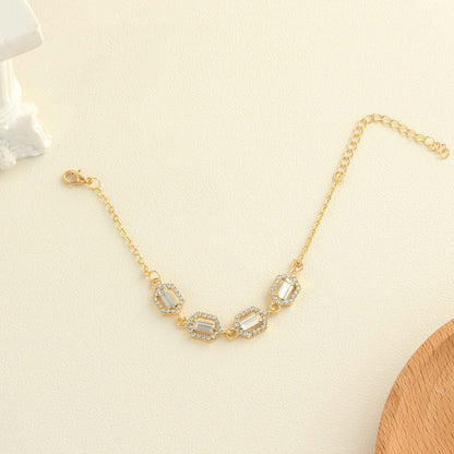 Rhinestone geometric anklet set featuring a gold layered design for women, showcasing sparkling rhinestones.